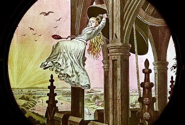 An image of a magic lantern slide from the late 19th century. The circlular image features a young woman suspended between columns with a brightly lite sky and futuristic city landscape behind her.