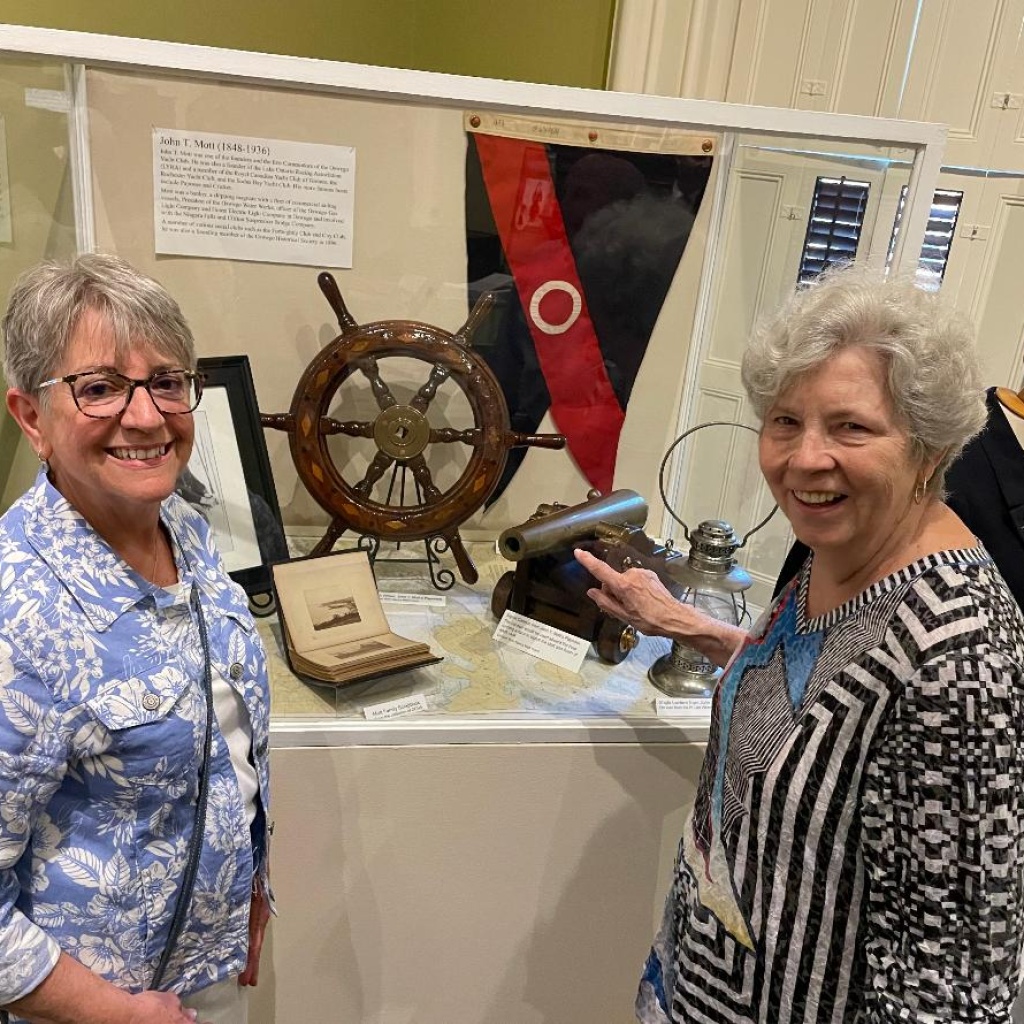 Eva Corradino and Nancy Mott Frank in front of John T. Mott case-OYC-Exhibit